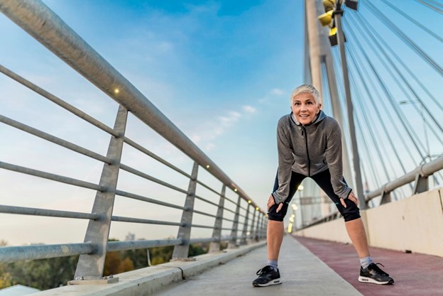 A woman poses during her run through a Maryland park.