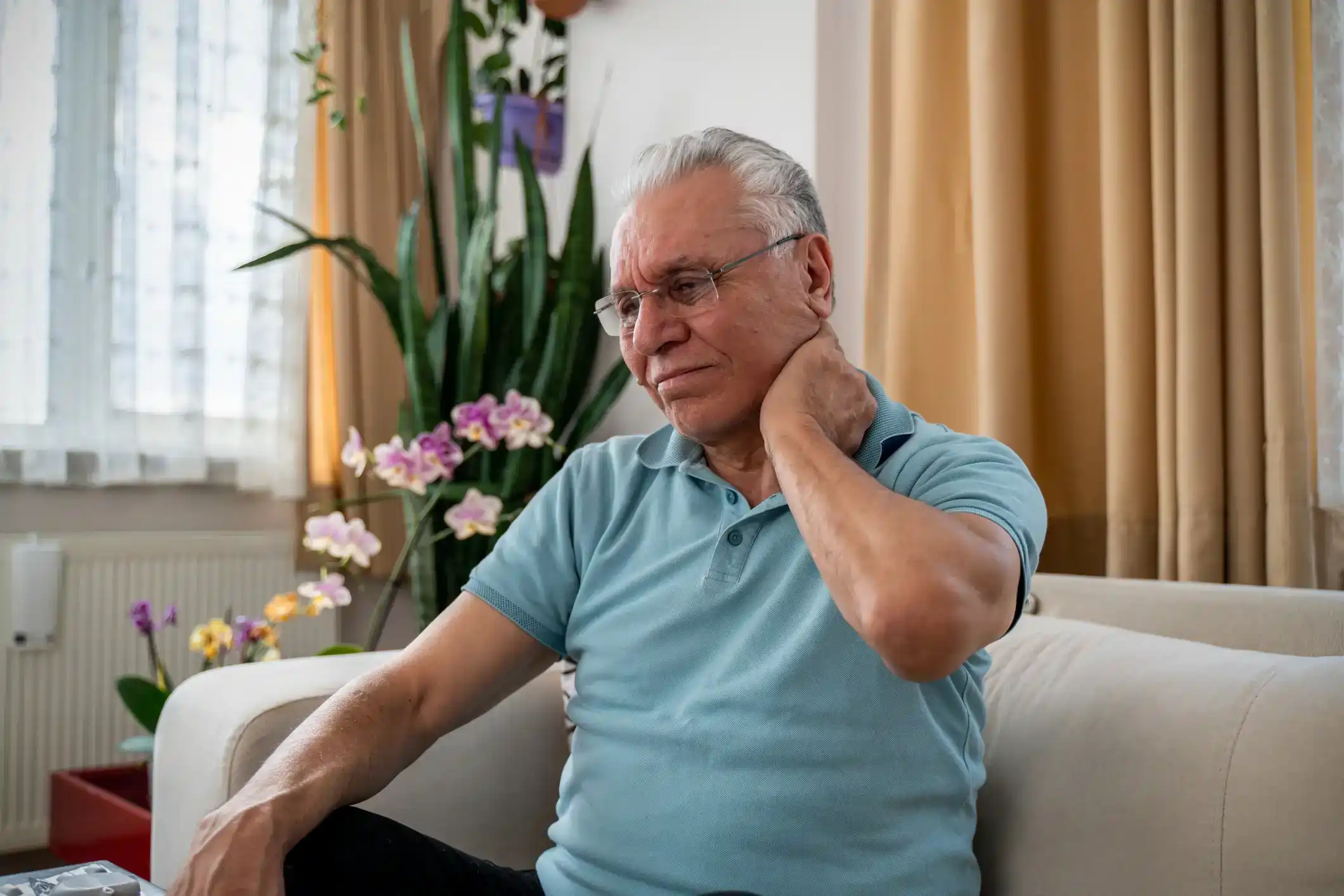 An aged man experiencing neck pain